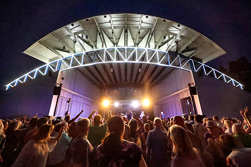 Photo of a lighted stage and audience