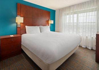 Photo of a bed in a hotel room