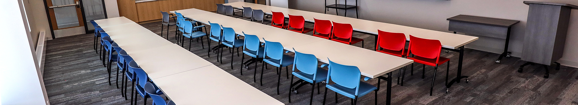 A row of chairs in a meeting room