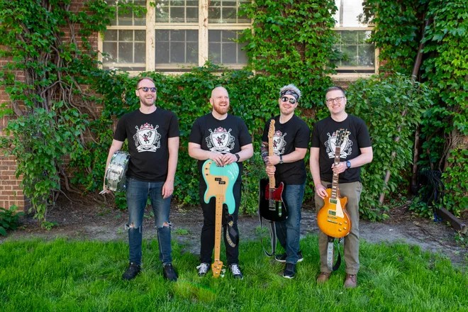 Image of the band Riffin Griffin standing outside with their instruments